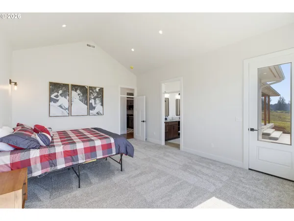 a living room with furniture and painting on the wall