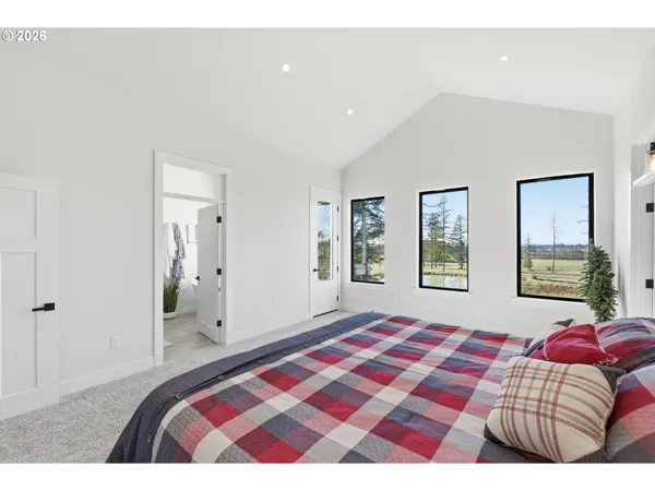 a bedroom with a bed and a couch