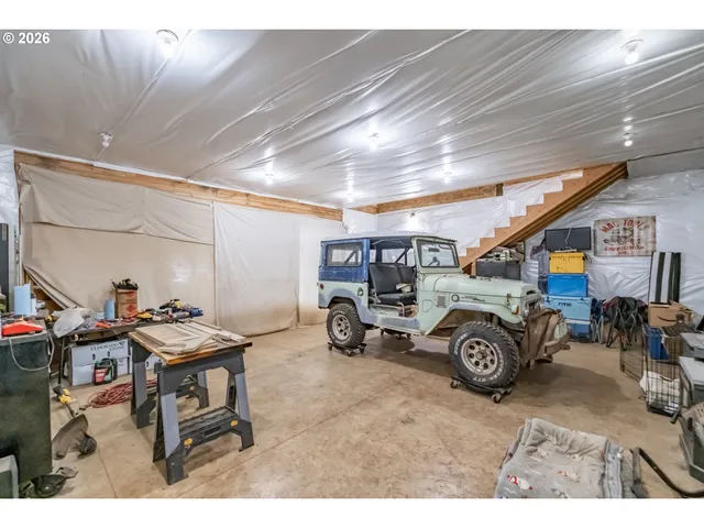 a view of a garage with a car parked