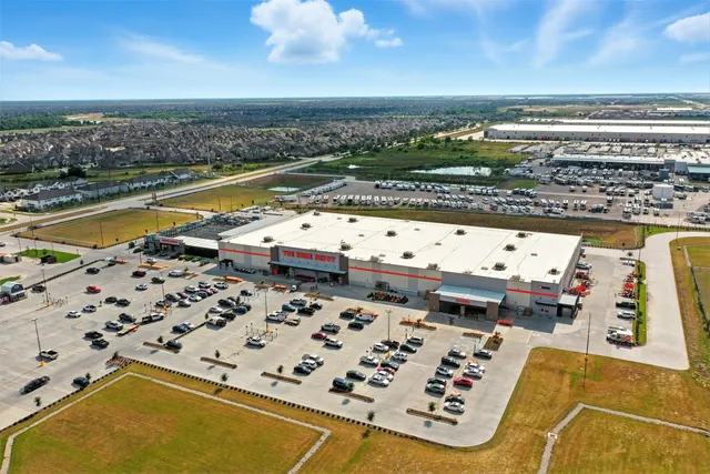 an aerial view of residential building and ocean view