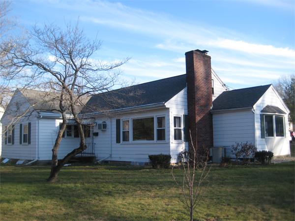 7 Pilgrim Way Walpole, MA 02032 - Photo 1 of 17 a backyard of a house with lots of green space