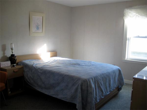 7 Pilgrim Way Walpole, MA 02032 - Photo 8 of 17 a bedroom with a bed and window