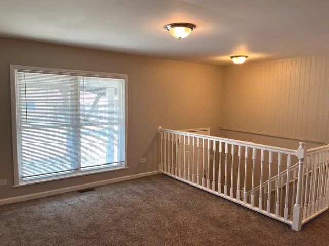 a view of a livingroom with a staircase
