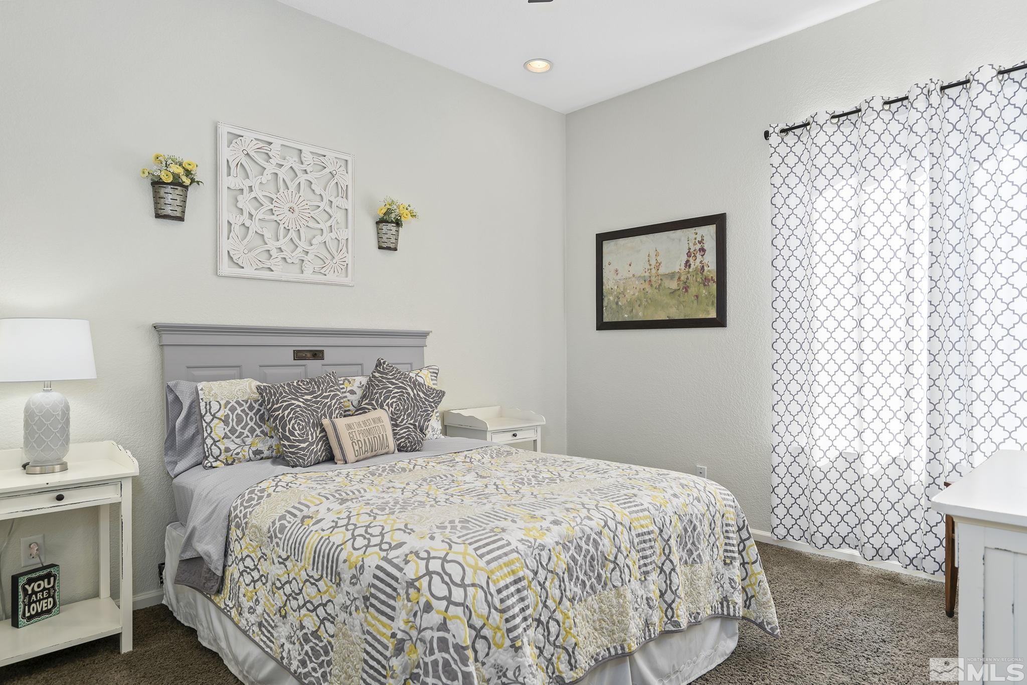 2095 North Tesuque Road Reno, NV 89511 - Photo 23 of 40 a bedroom with a bed and a window