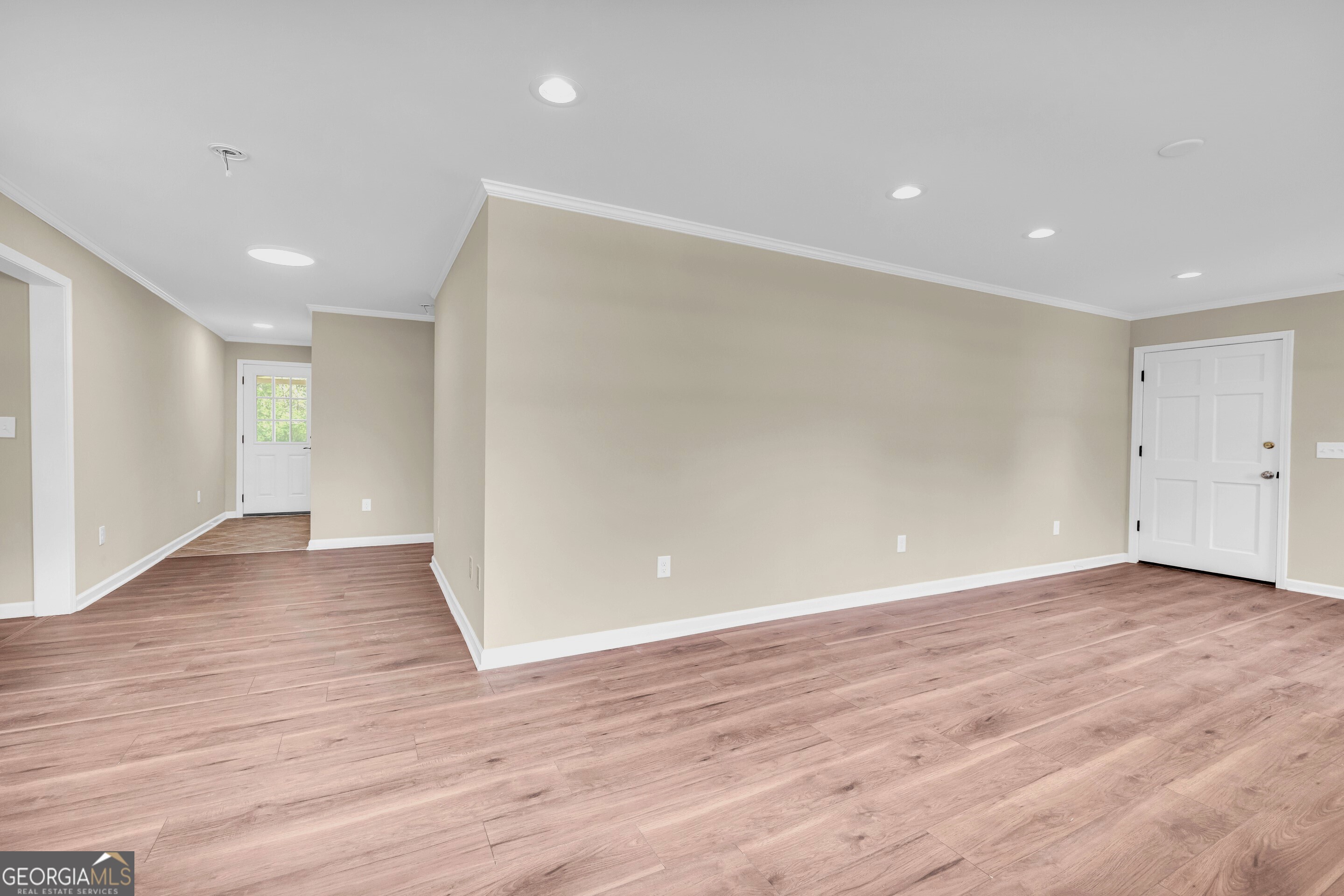 100 Broad Street Bowman, GA 30624 - Photo 20 of 65 an empty room with wooden floor and windows