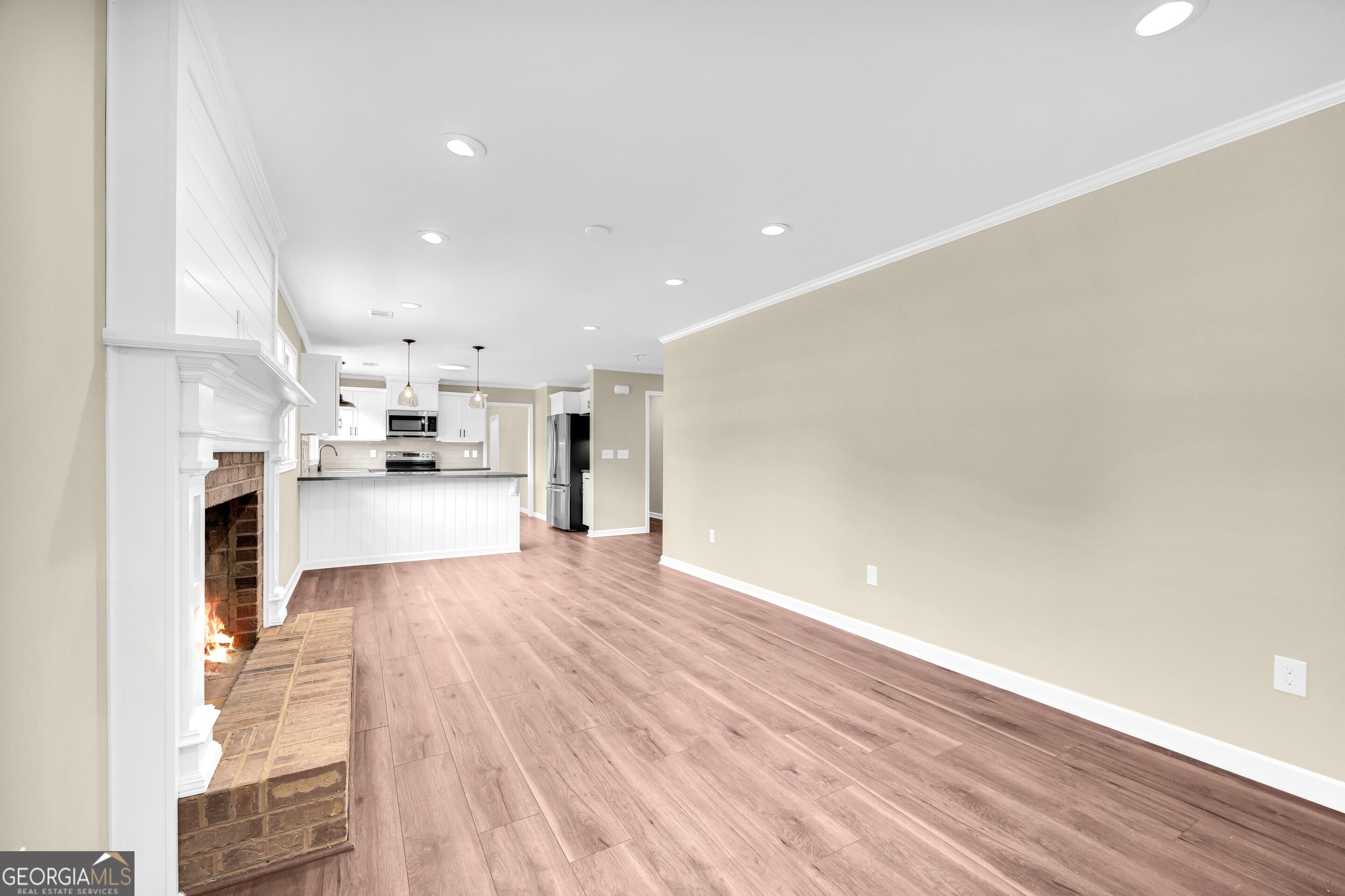100 Broad Street Bowman, GA 30624 - Photo 22 of 65 a view of kitchen with cabinets and wooden floor