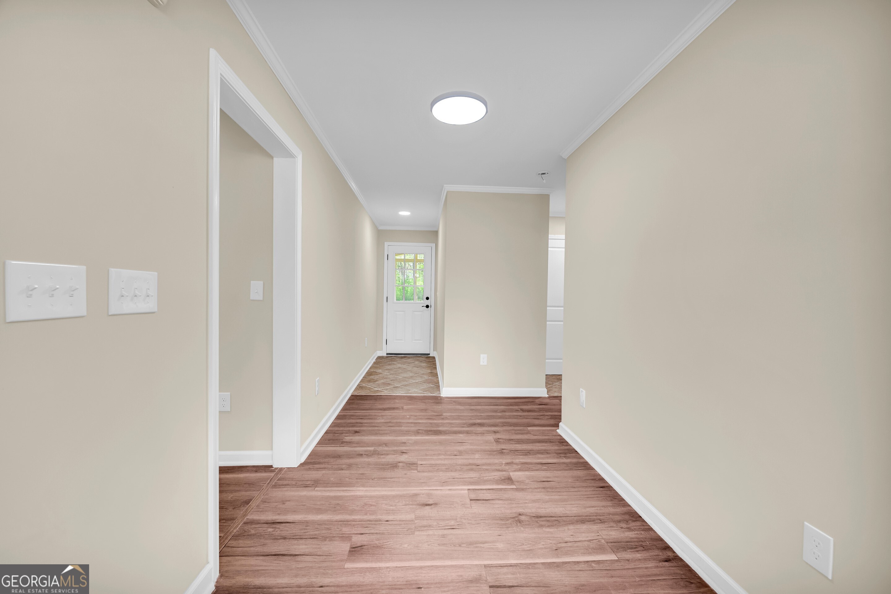 100 Broad Street Bowman, GA 30624 - Photo 28 of 65 a view of a hallway with wooden floor