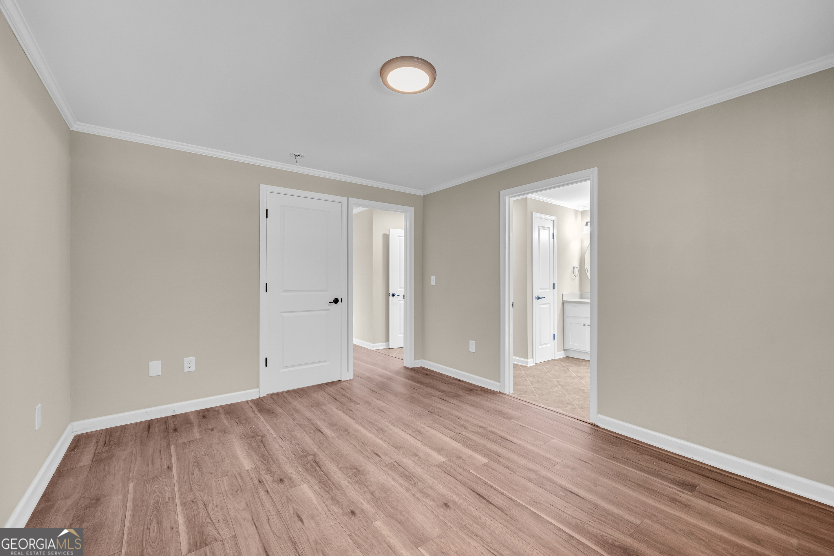 100 Broad Street Bowman, GA 30624 - Photo 31 of 65 a view of an empty room with wooden floor