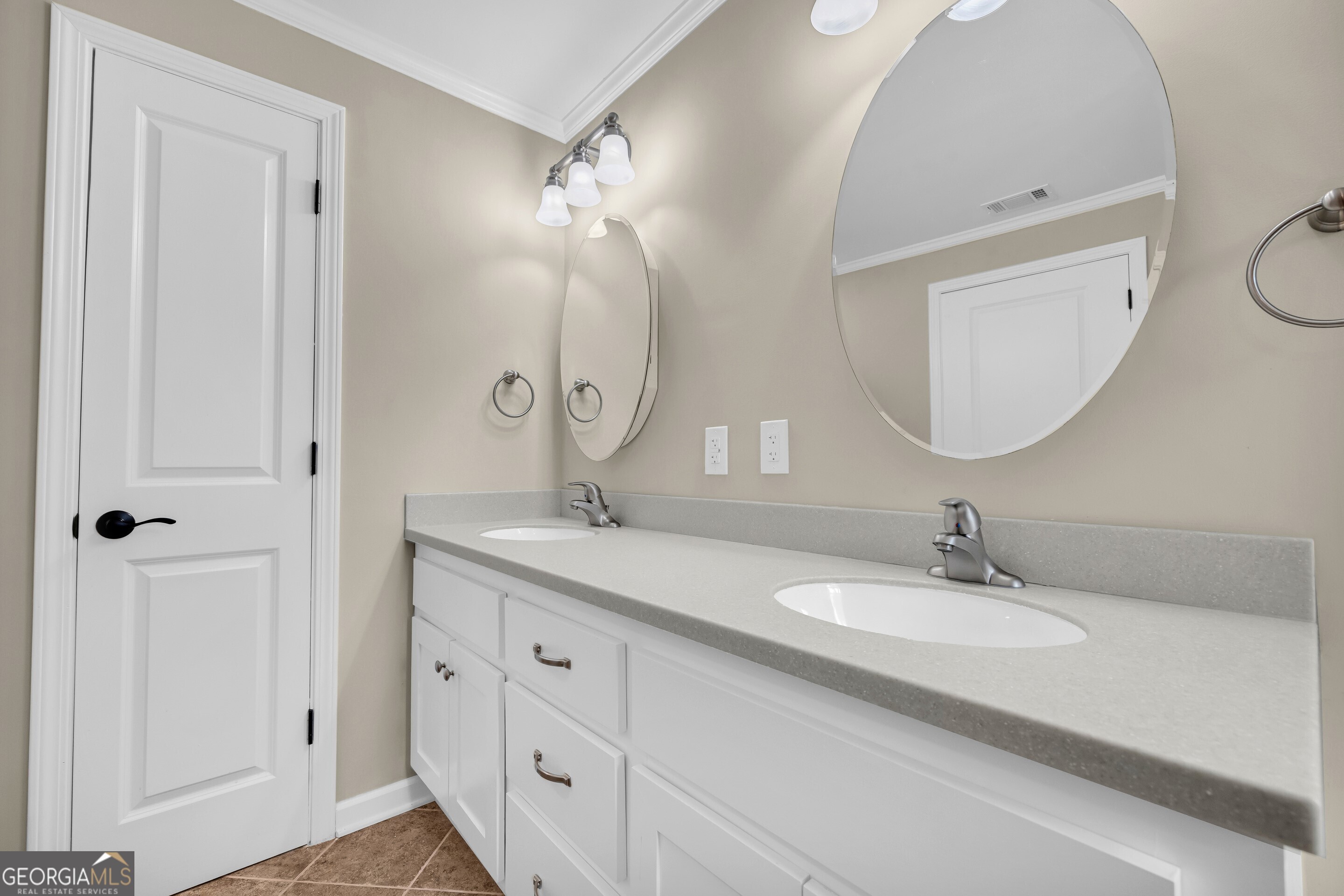 100 Broad Street Bowman, GA 30624 - Photo 33 of 65 a bathroom with a double vanity sink and a mirror