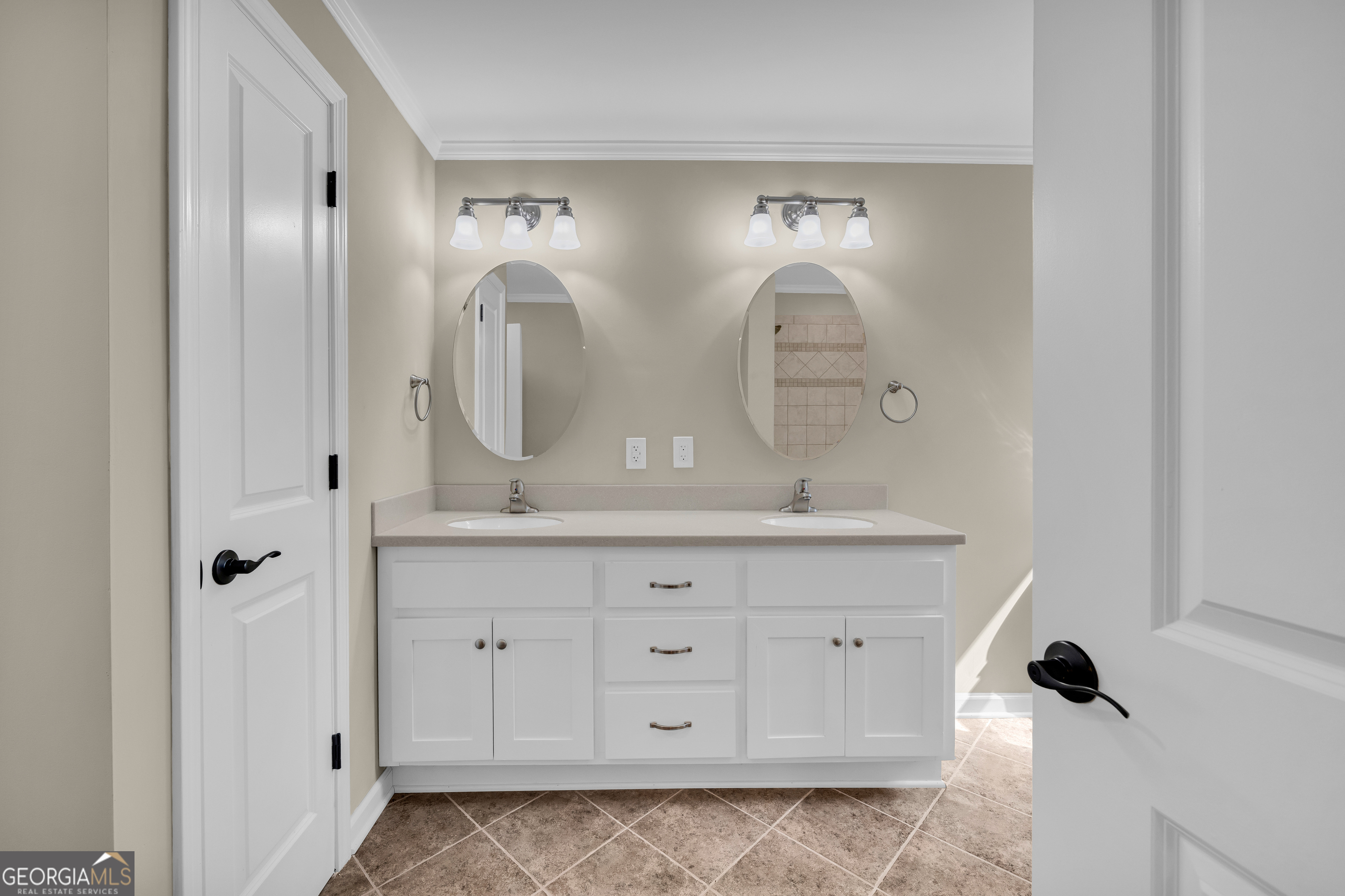 100 Broad Street Bowman, GA 30624 - Photo 34 of 65 a bathroom with a double vanity sink and mirror