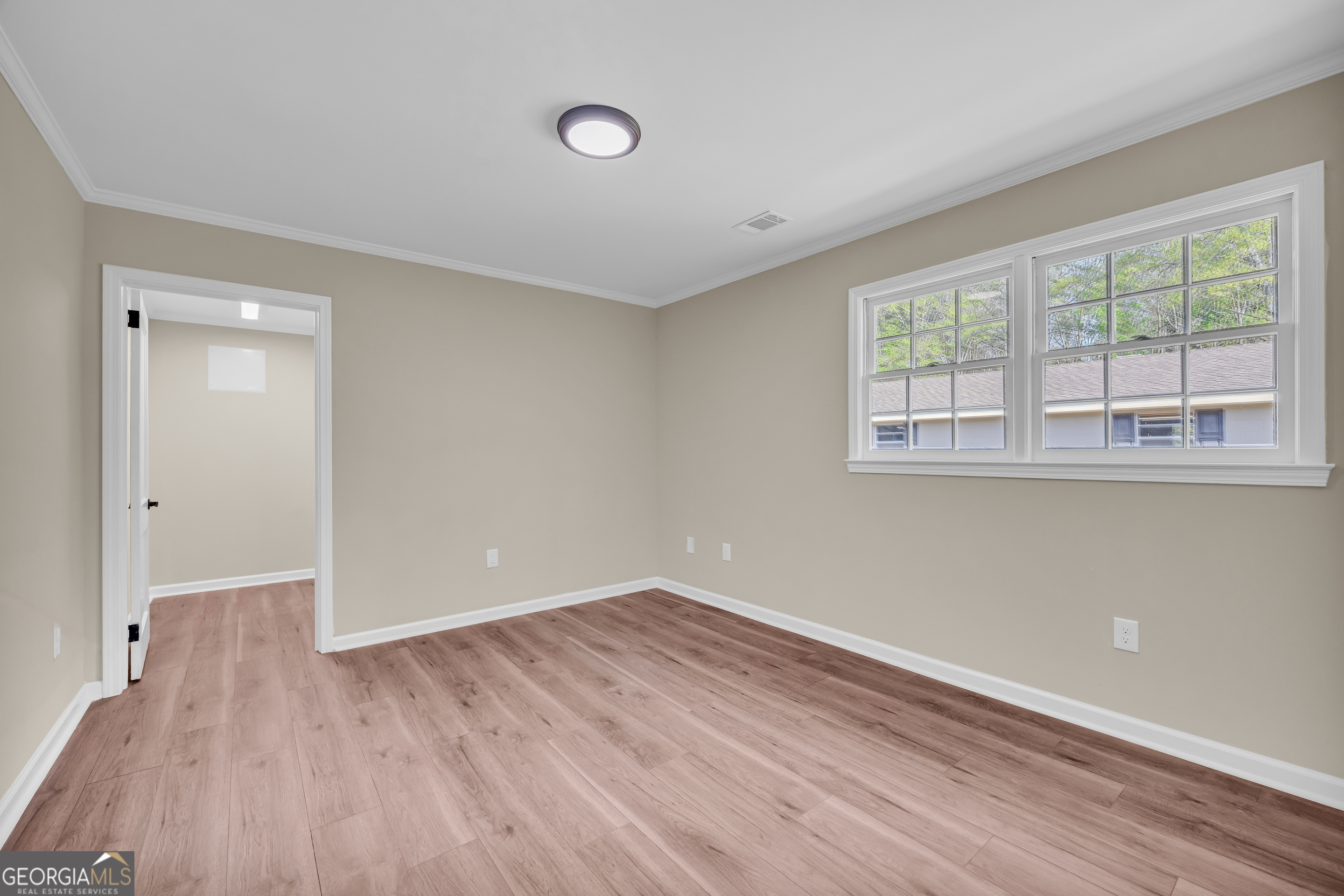 100 Broad Street Bowman, GA 30624 - Photo 38 of 65 wooden floor in an empty room with a window
