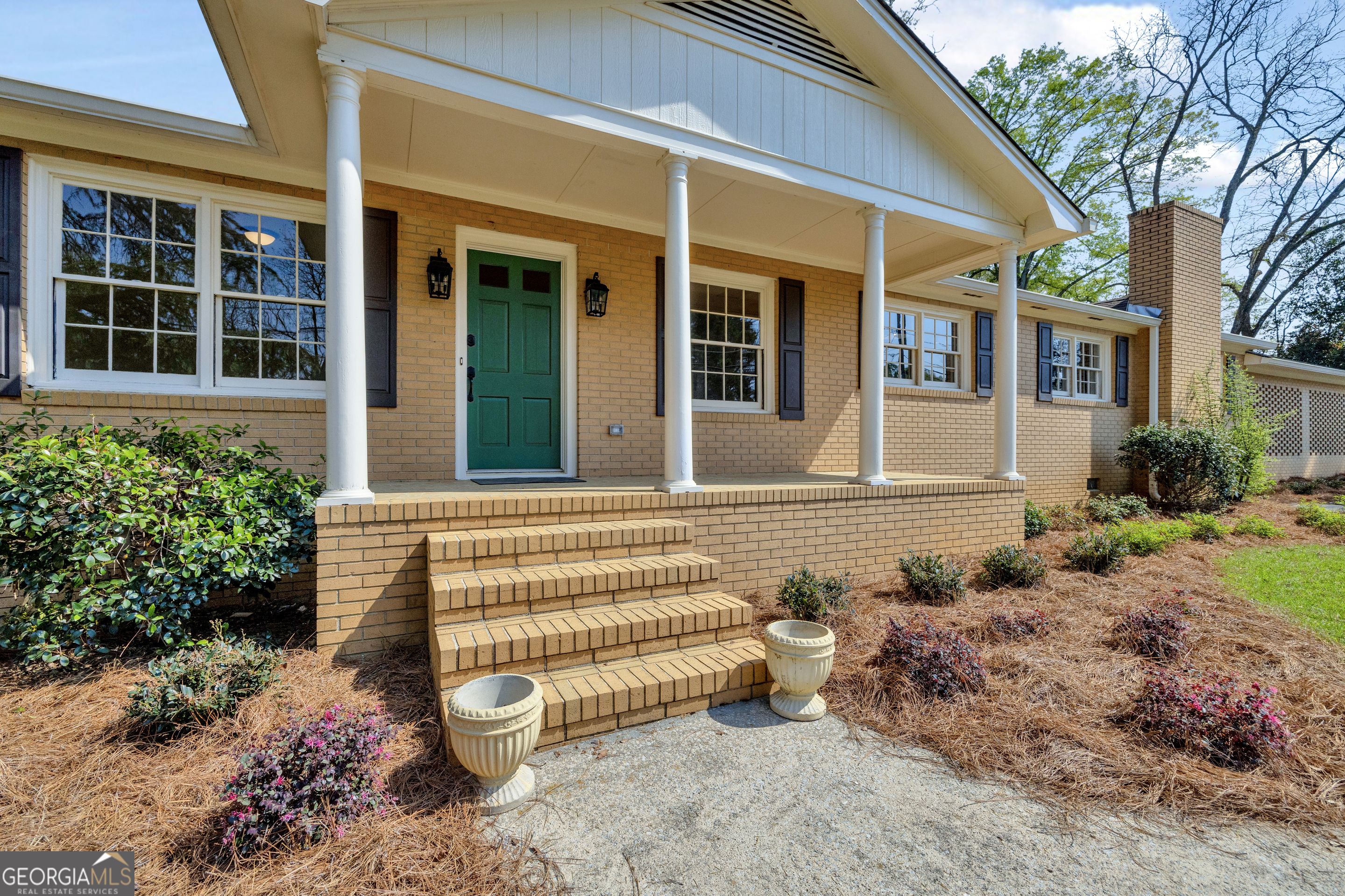 100 Broad Street Bowman, GA 30624 - Photo 4 of 65 a front view of a house with a yard