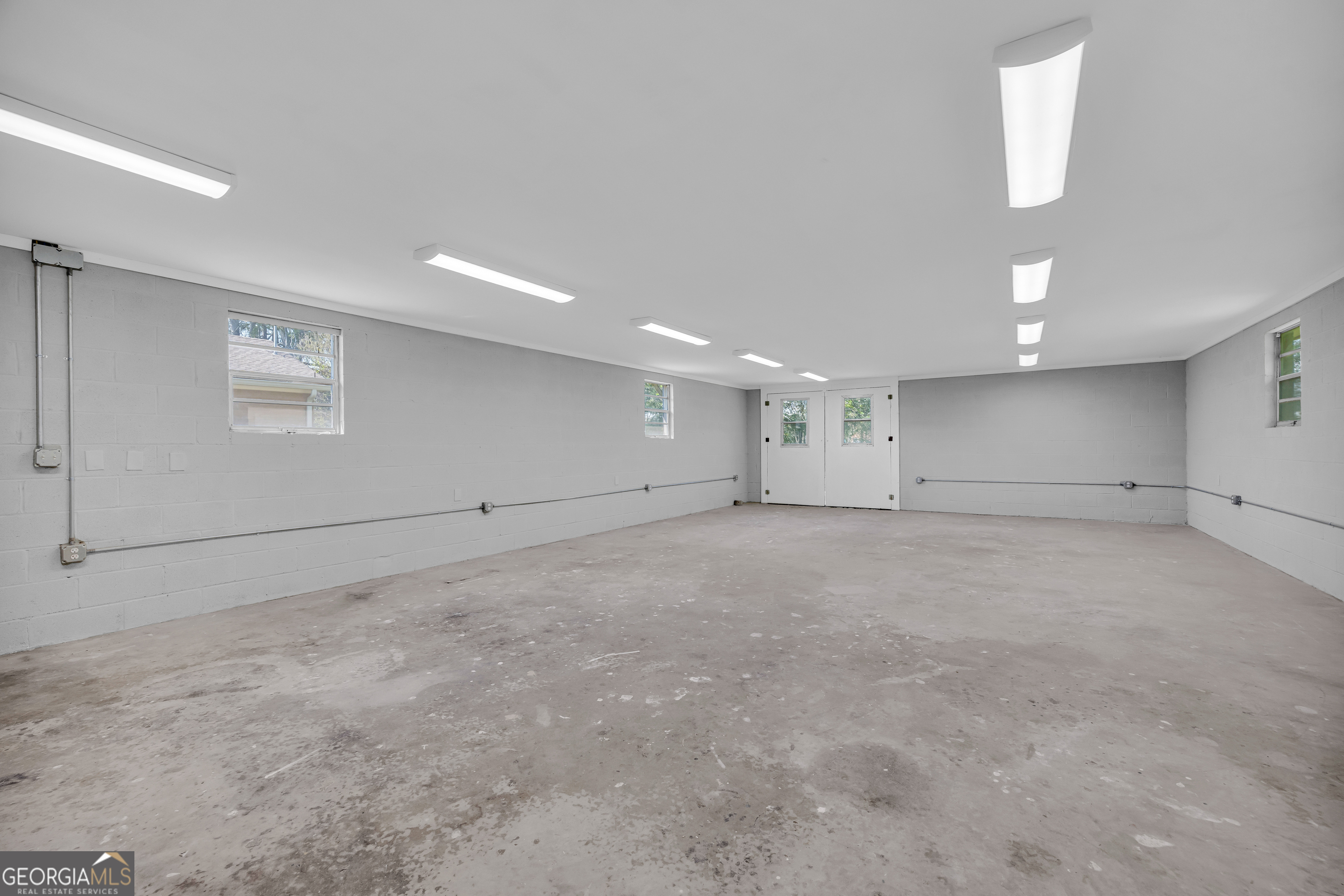 100 Broad Street Bowman, GA 30624 - Photo 50 of 65 an empty room with white walls and windows