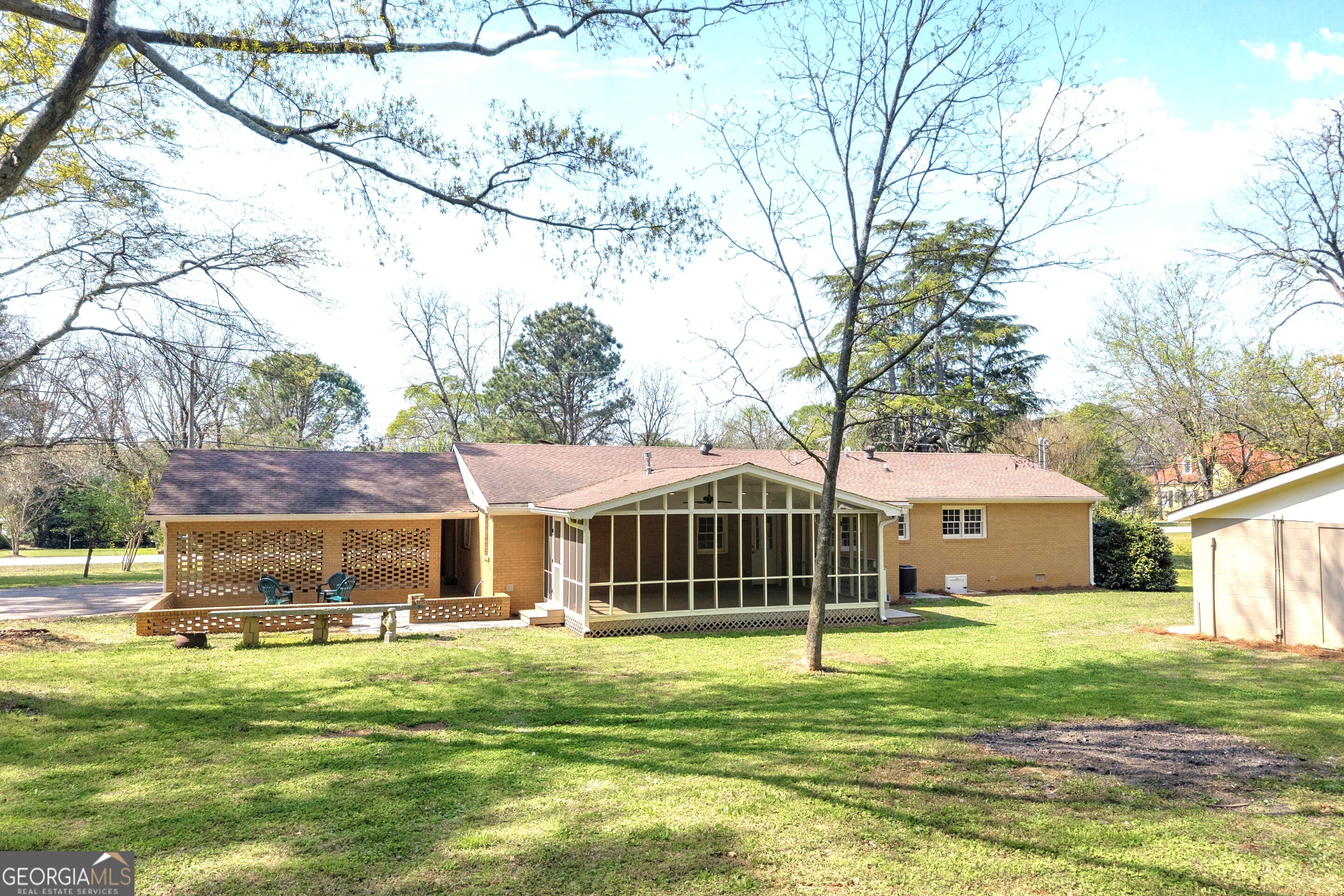 100 Broad Street Bowman, GA 30624 - Photo 53 of 65 a view of a house with a yard patio and swimming pool