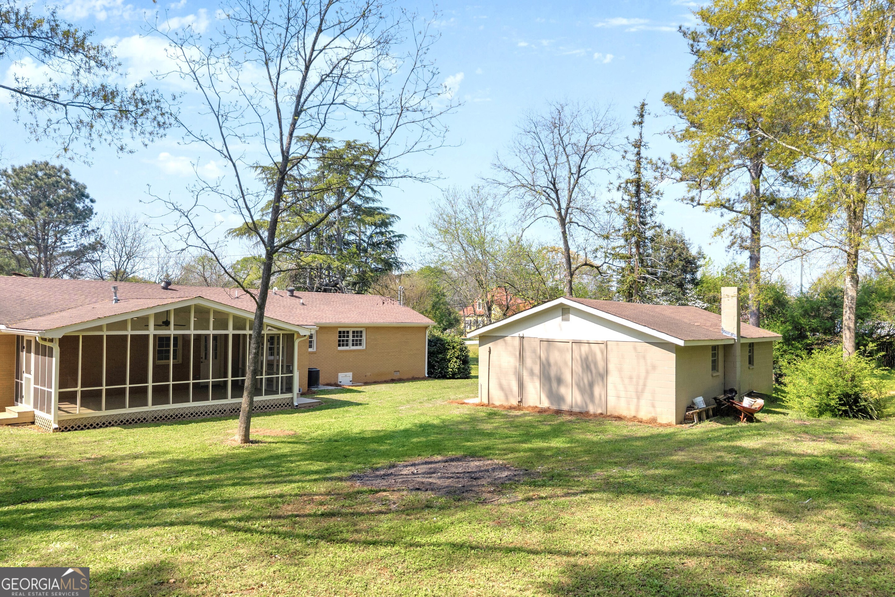 100 Broad Street Bowman, GA 30624 - Photo 54 of 65 a view of a house with a backyard and a tree