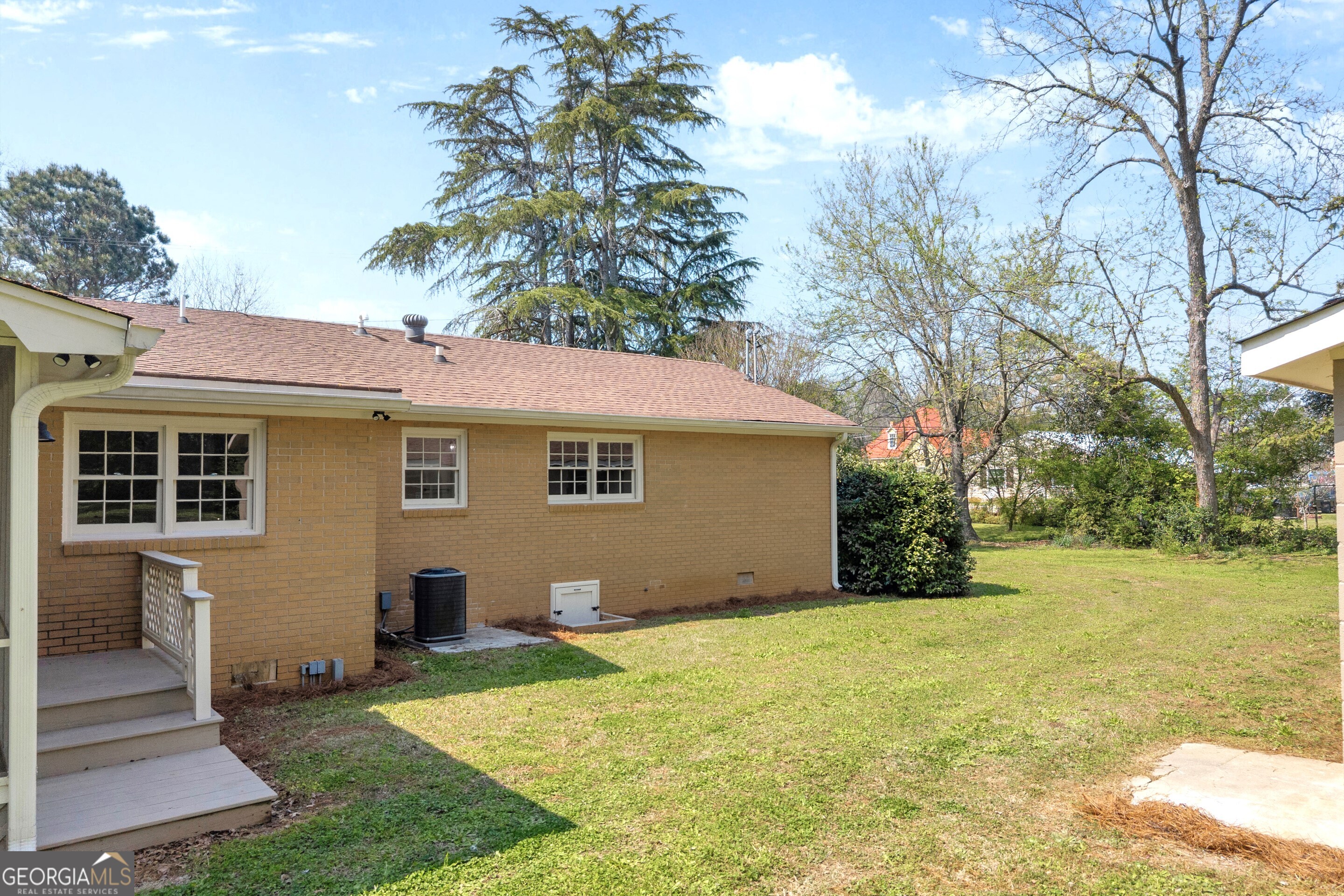 100 Broad Street Bowman, GA 30624 - Photo 56 of 65 a front view of house with yard and trees around