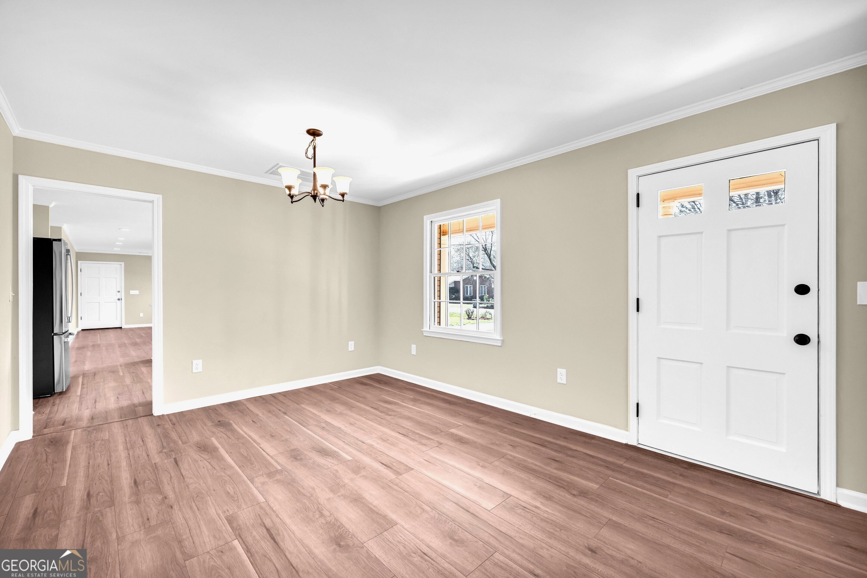 100 Broad Street Bowman, GA 30624 - Photo 7 of 65 a view of livingroom with hardwood floor and hallway