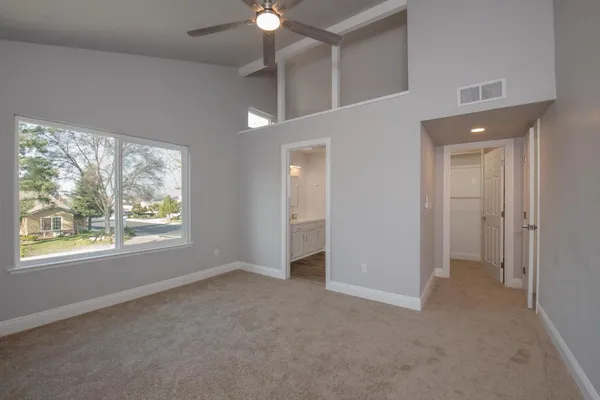 a view of an empty room with a window