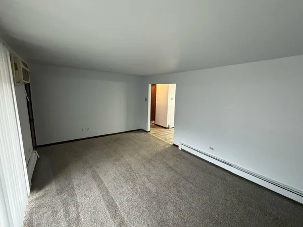 a view of an empty room and window