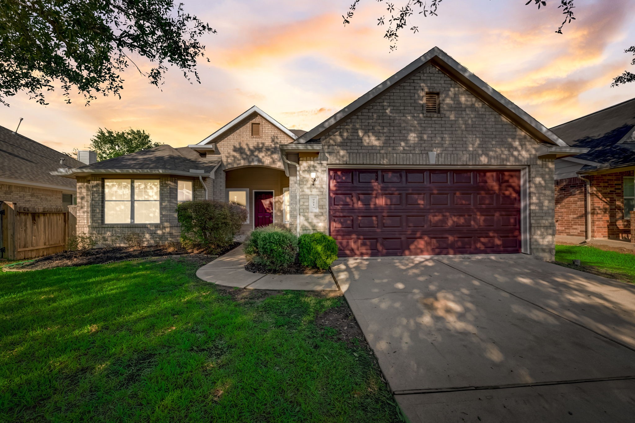 7219 Palmito Ranch Drive Richmond, TX 77406 - Photo 1 of 32 a front view of a house with garden