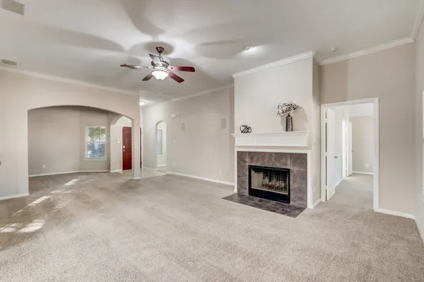 a large white kitchen with a large window