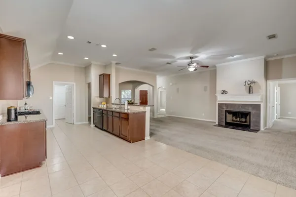 a kitchen with a sink and a fireplace