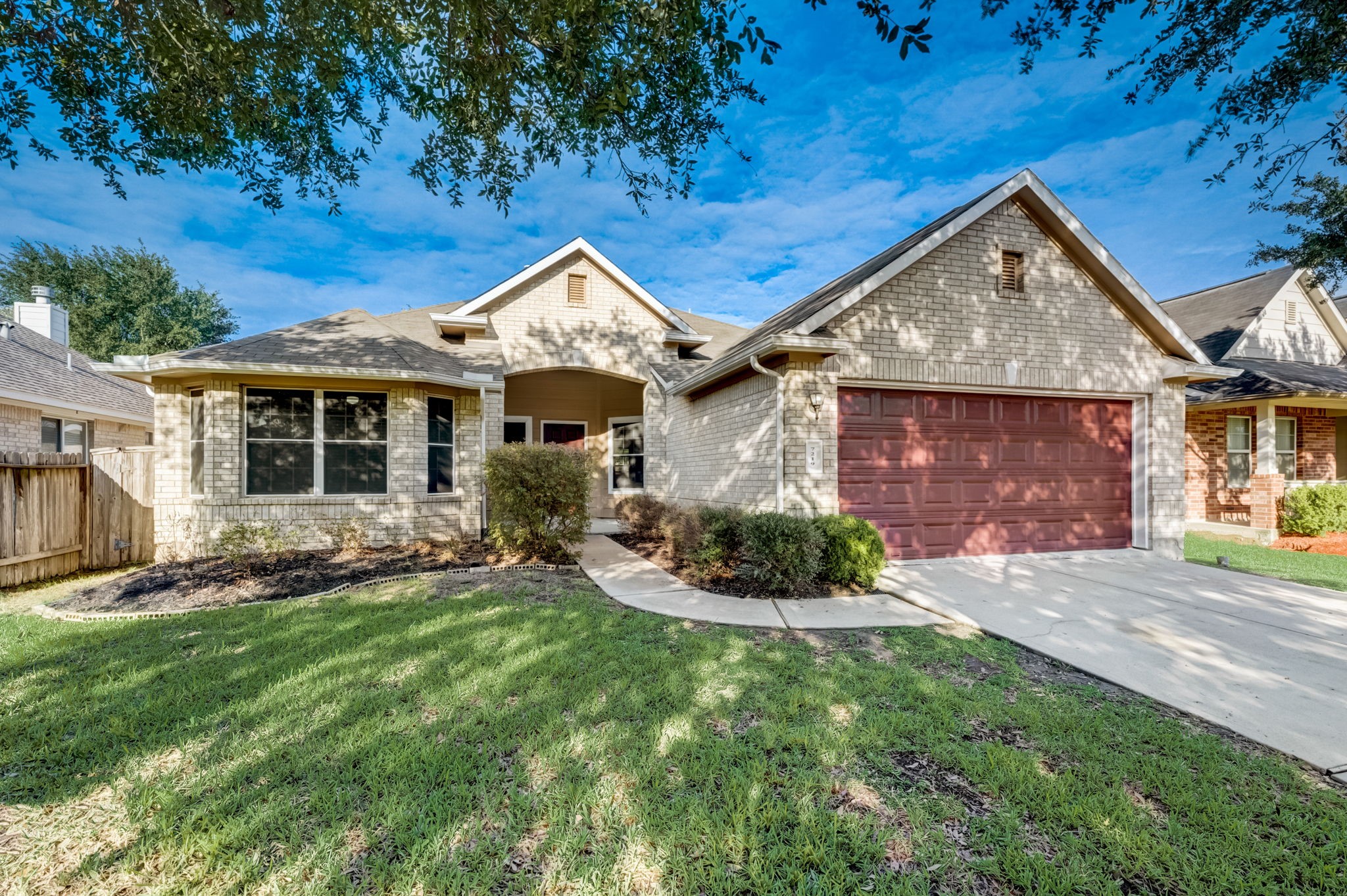 7219 Palmito Ranch Drive Richmond, TX 77406 - Photo 2 of 32 a front view of a house with a yard and porch