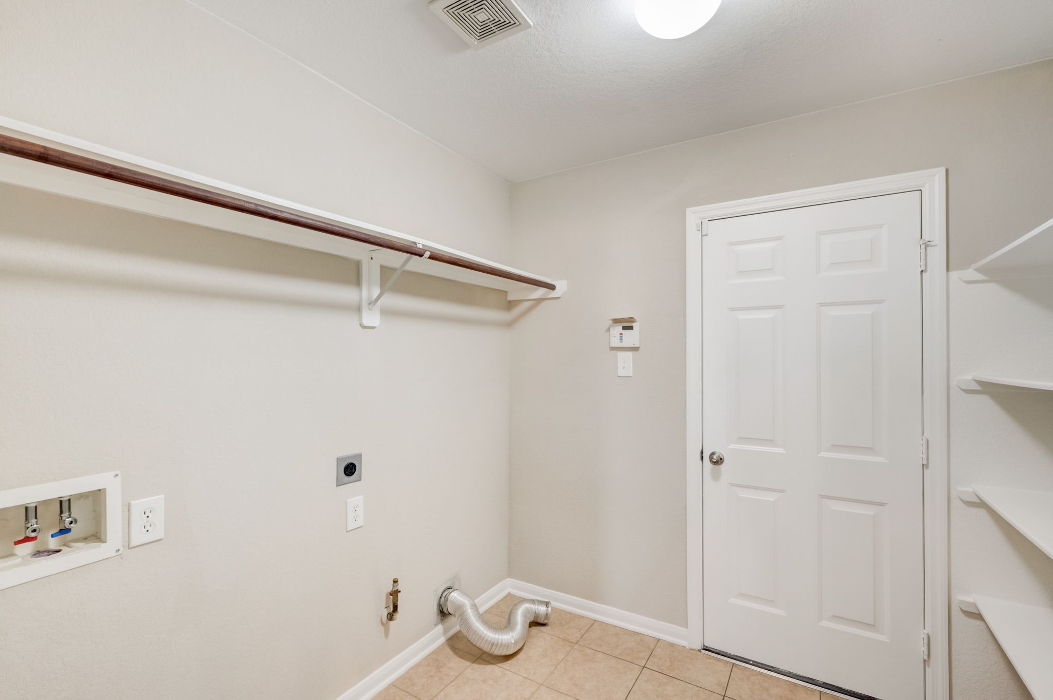7219 Palmito Ranch Drive Richmond, TX 77406 - Photo 24 of 32 a view of small space with racks on the wall
