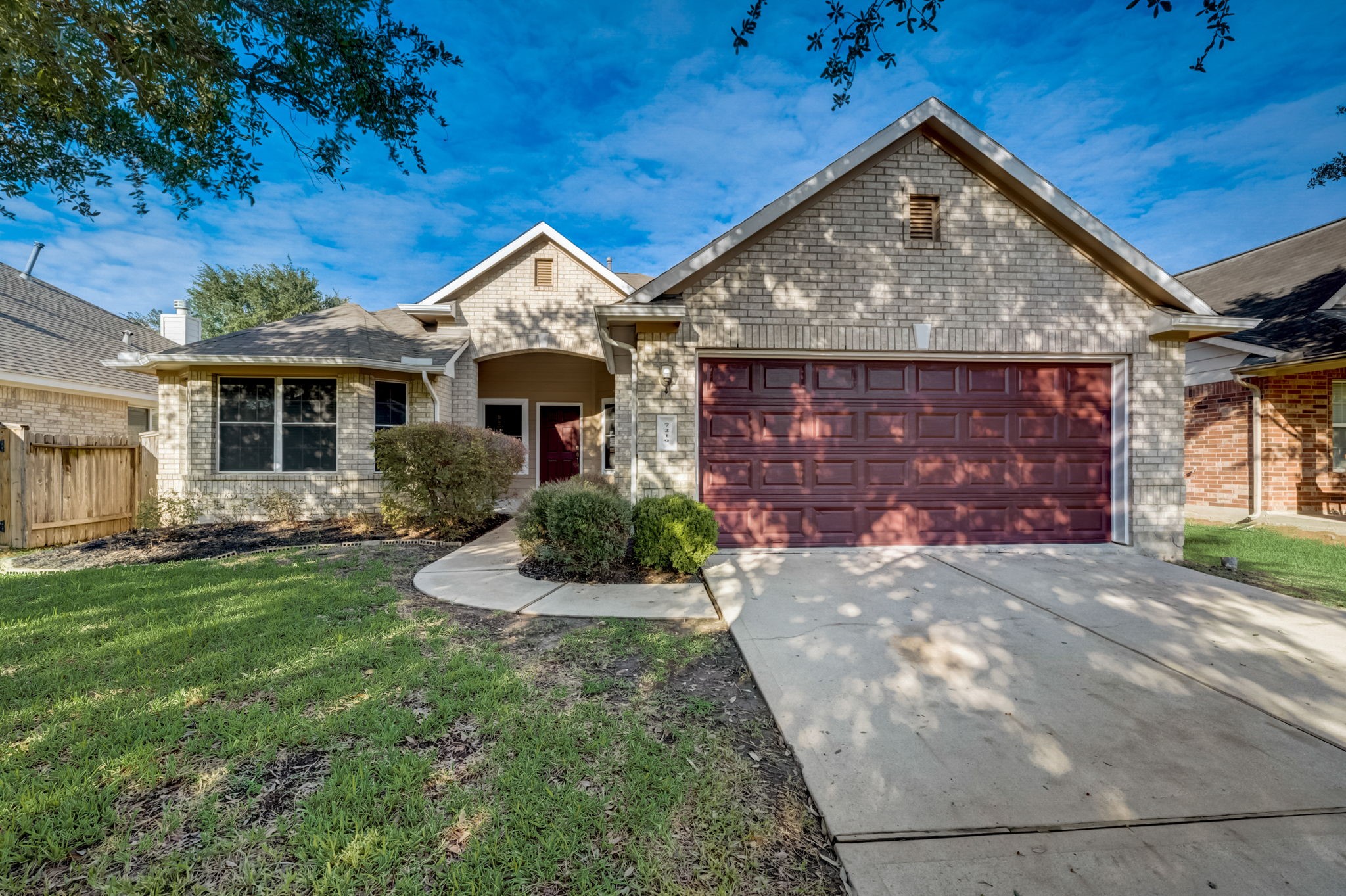 7219 Palmito Ranch Drive Richmond, TX 77406 - Photo 3 of 32 a front view of a house with a yard and garage