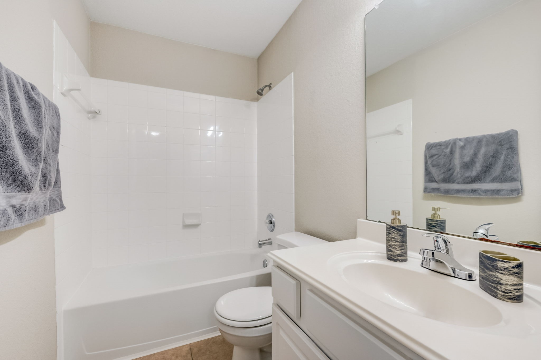 7219 Palmito Ranch Drive Richmond, TX 77406 - Photo 10 of 32 a bathroom with a sink a toilet and shower