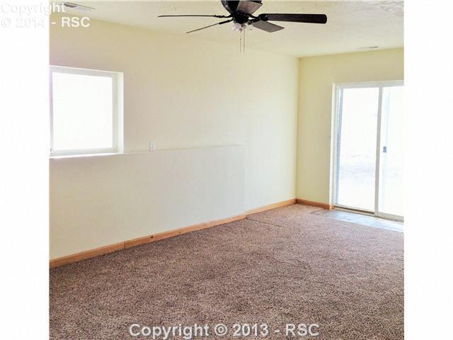 7950 Mulberry Road Calhan, CO 80808 - Photo 25 of 25 The lower level of this efficient floor plan is all family room ad is all filly above ground. Access the deep crawl space from this level. There is also a 34 bath on this level making this a 4 bathroom home.