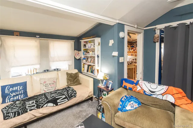 a bedroom with bed and a window