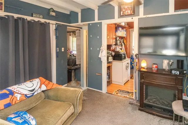 a bedroom with a bed and a mirror