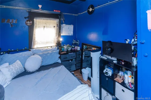 a bed room with a bed mirror and bathroom