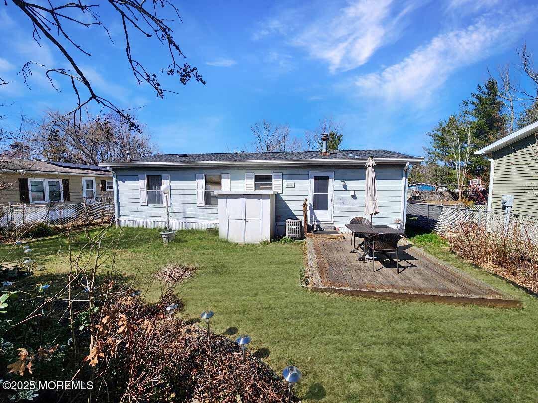5 Fallow Drive Manalapan, NJ 07726 - Photo 17 of 23 a view of a house with backyard and sitting area