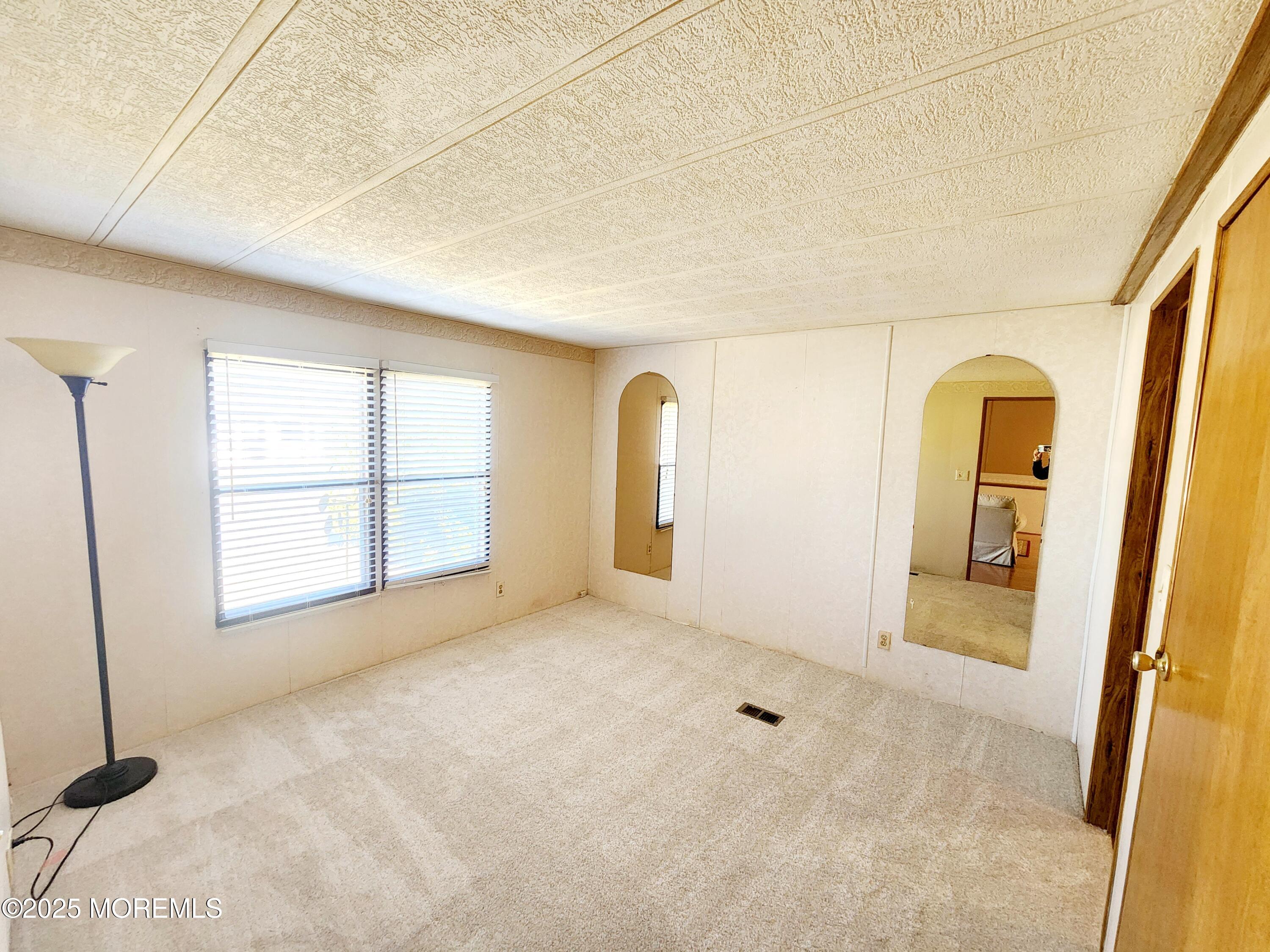 5 Fallow Drive Manalapan, NJ 07726 - Photo 6 of 23 a view of an empty room with a window