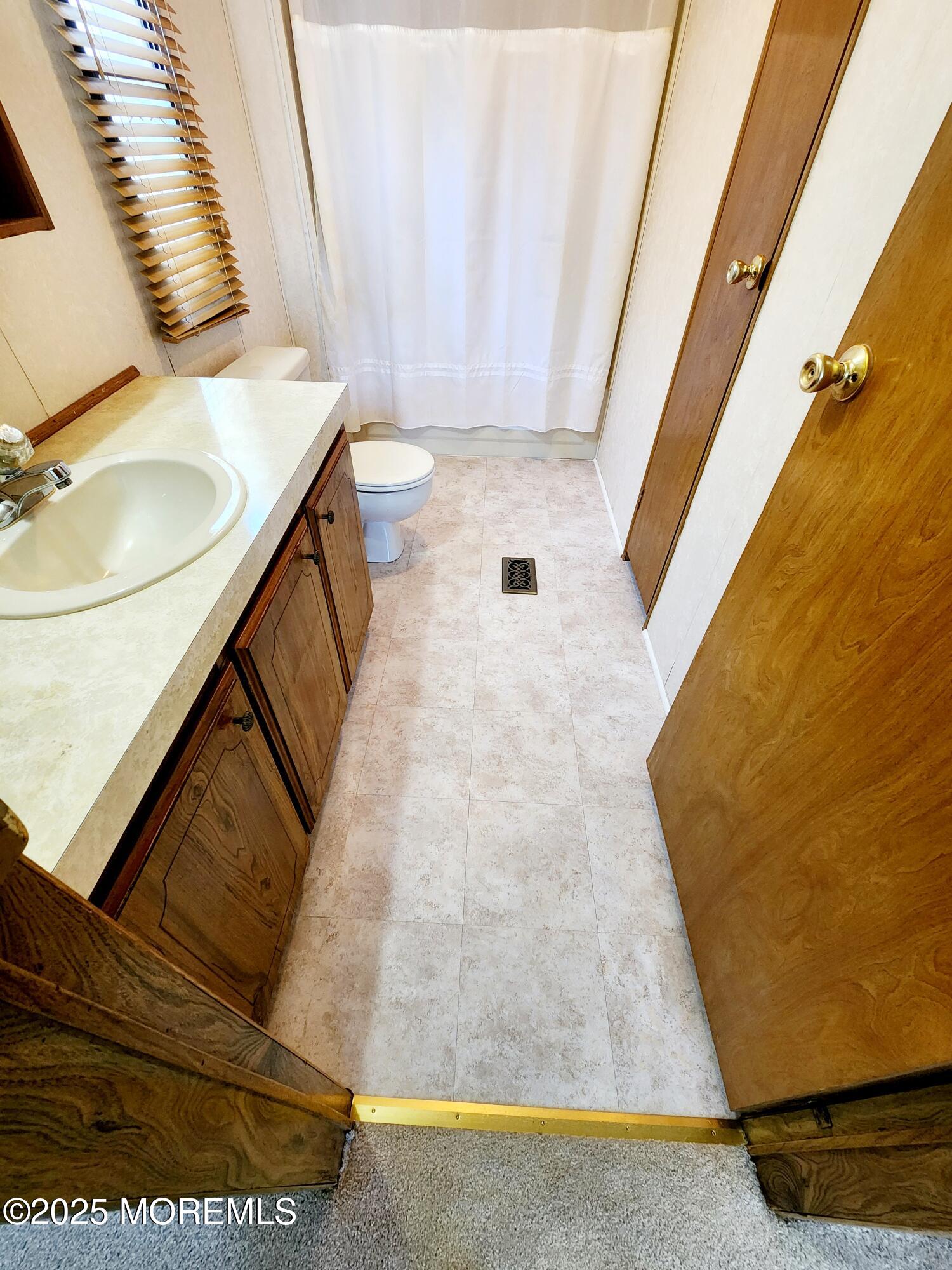 5 Fallow Drive Manalapan, NJ 07726 - Photo 10 of 23 a bathroom with a sink and a mirror