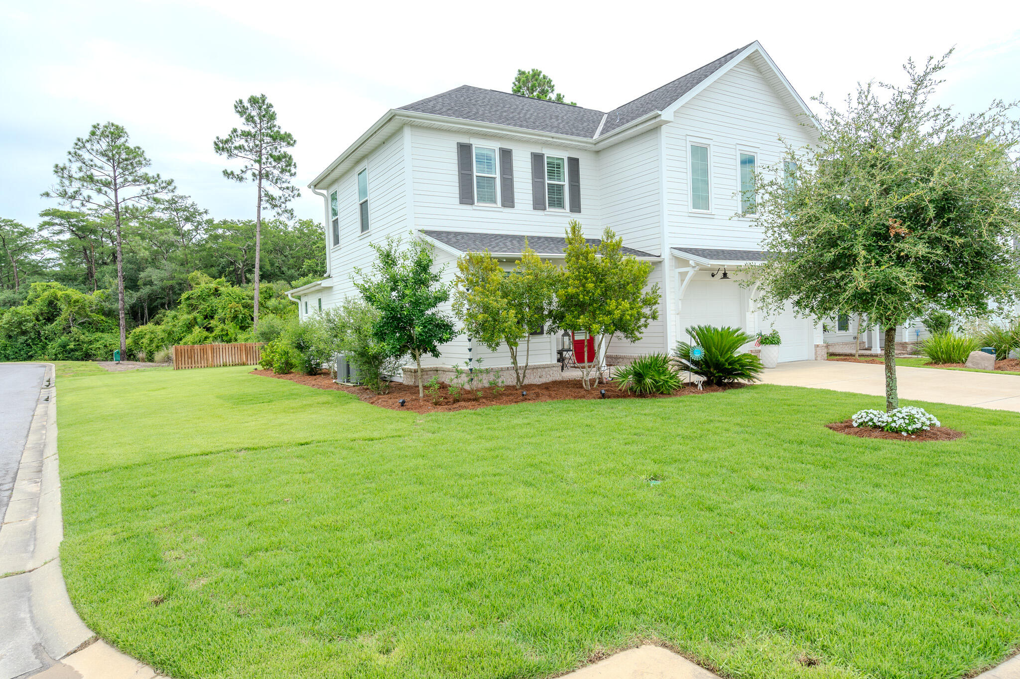 75 Conifer Ct Inlet Beach Inlet Beach, FL 32461 - Photo 2 of 74 a front view of a house with a yard