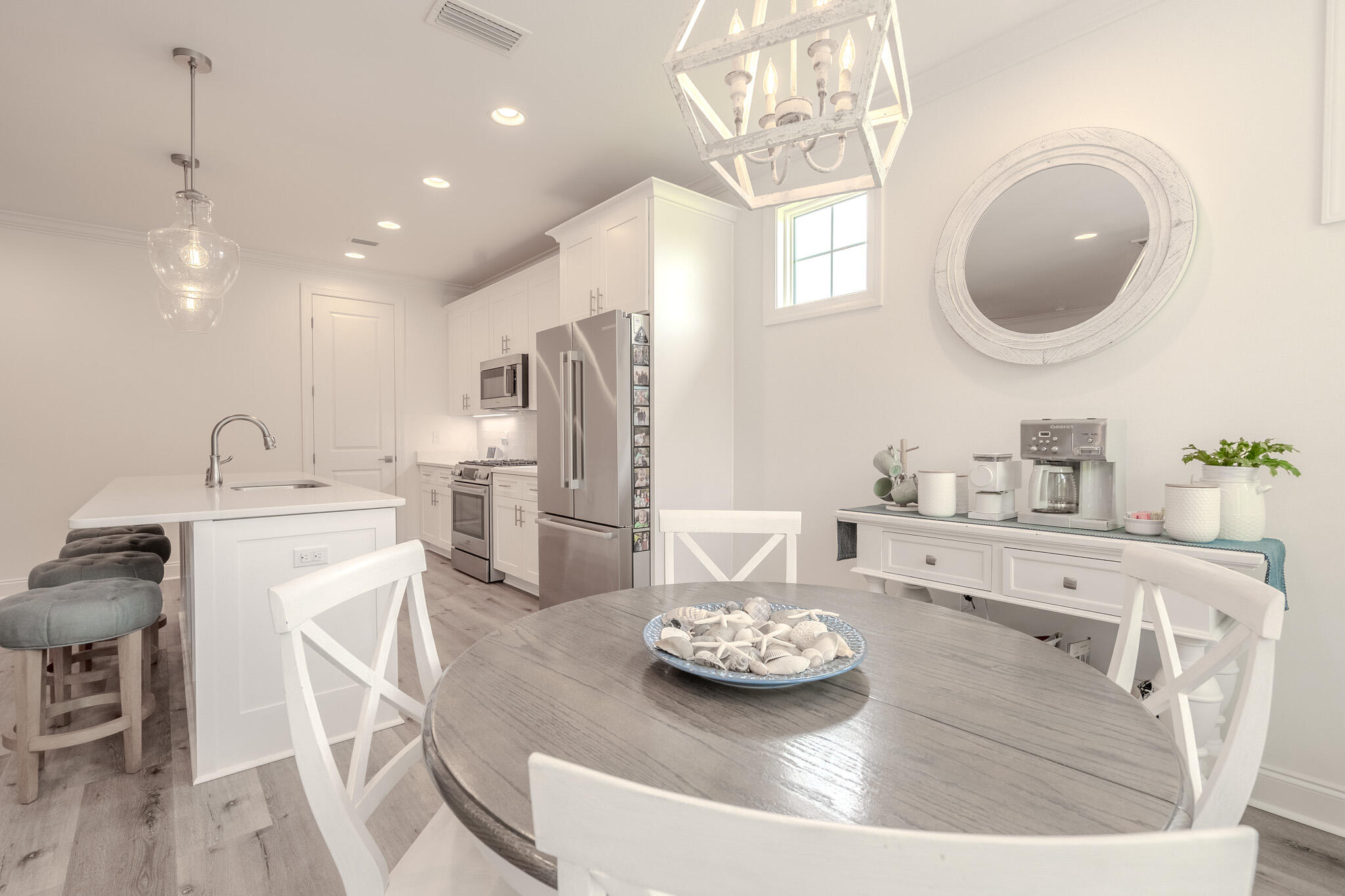 75 Conifer Ct Inlet Beach Inlet Beach, FL 32461 - Photo 24 of 74 a kitchen with stainless steel appliances granite countertop a sink a stove a refrigerator and a dining table with wooden floor