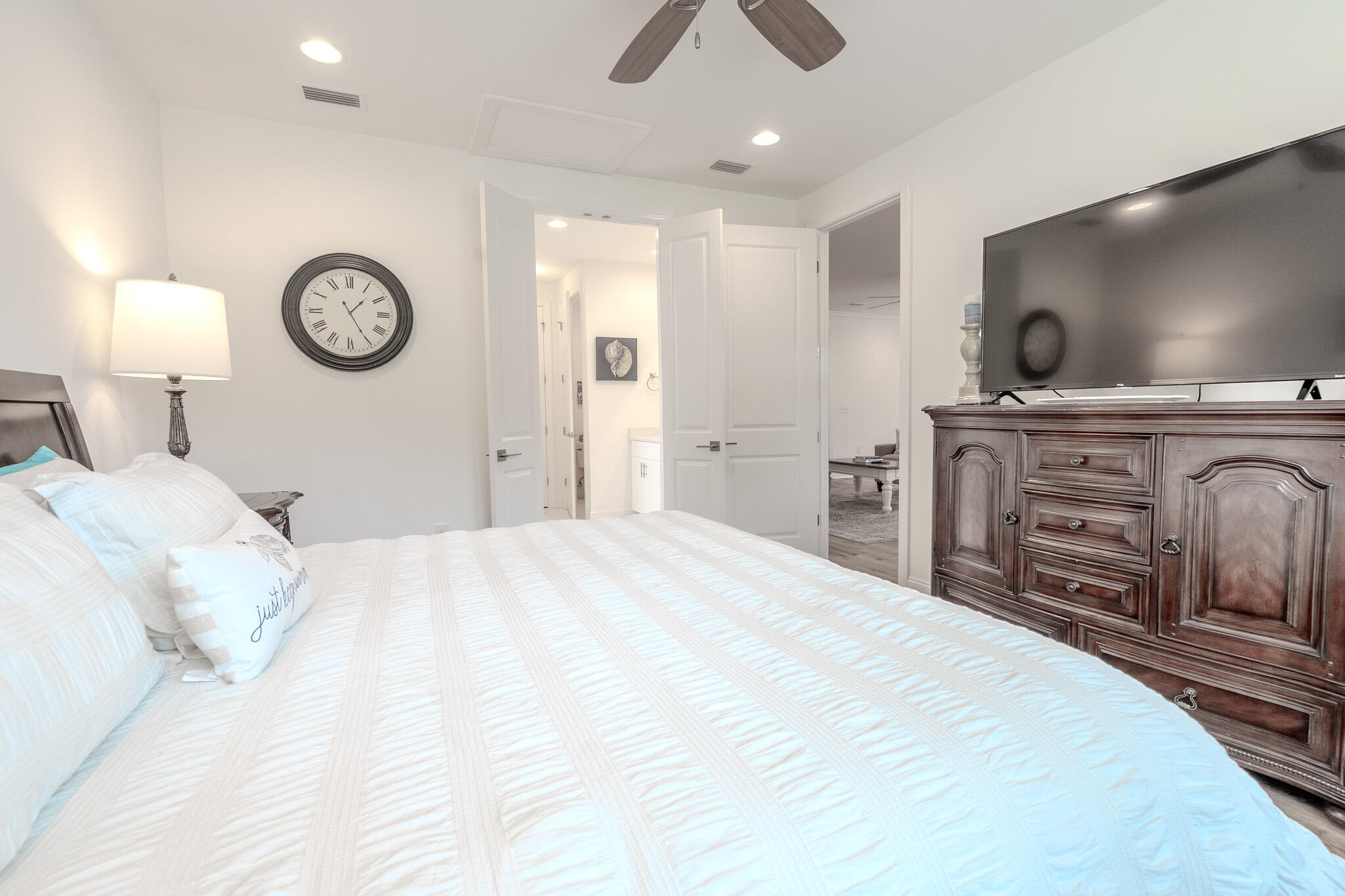 75 Conifer Ct Inlet Beach Inlet Beach, FL 32461 - Photo 28 of 74 a bedroom with a bed and a chandelier