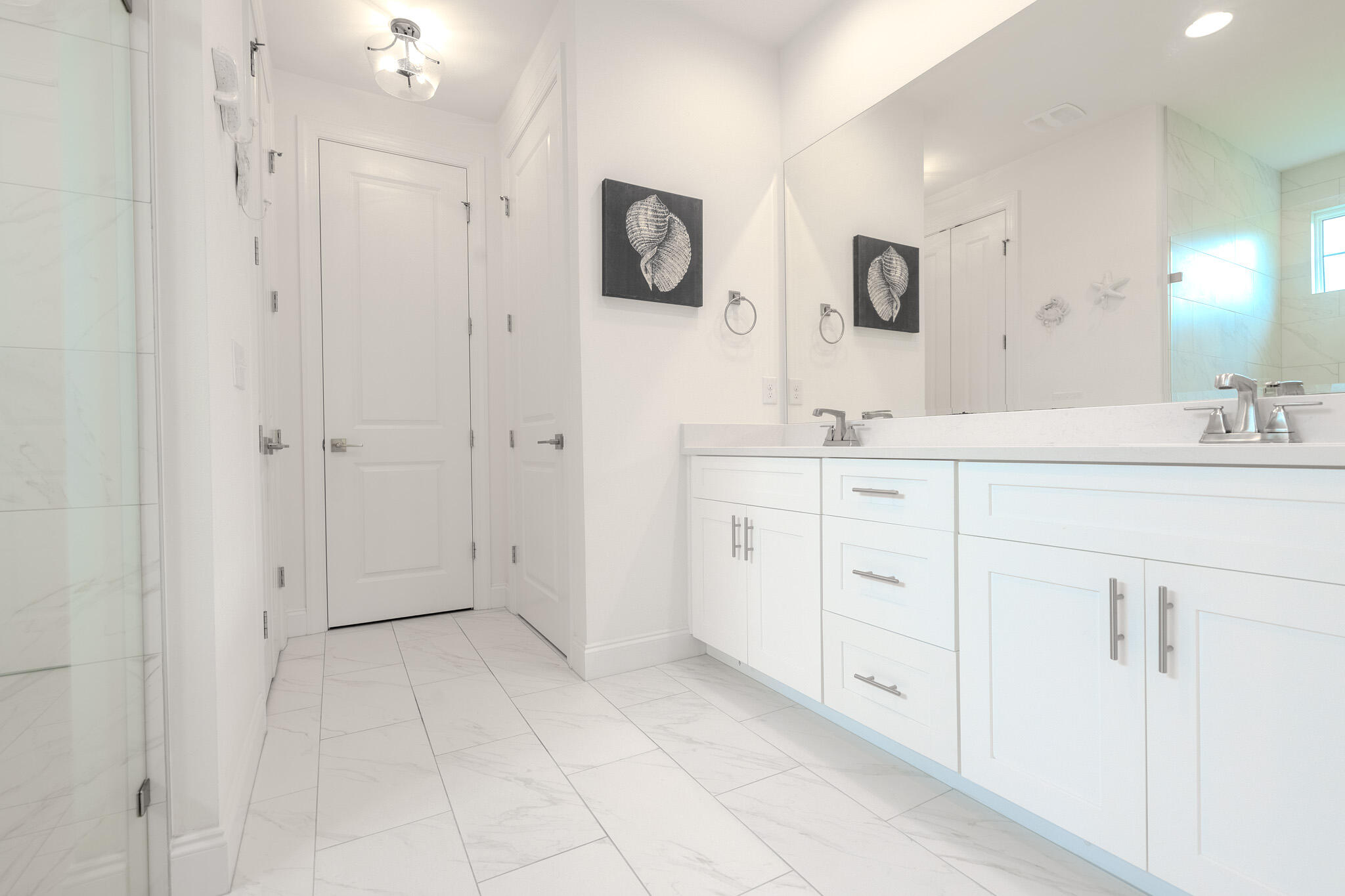 75 Conifer Ct Inlet Beach Inlet Beach, FL 32461 - Photo 30 of 74 a spacious bathroom with a double vanity sink a mirror a shower and a