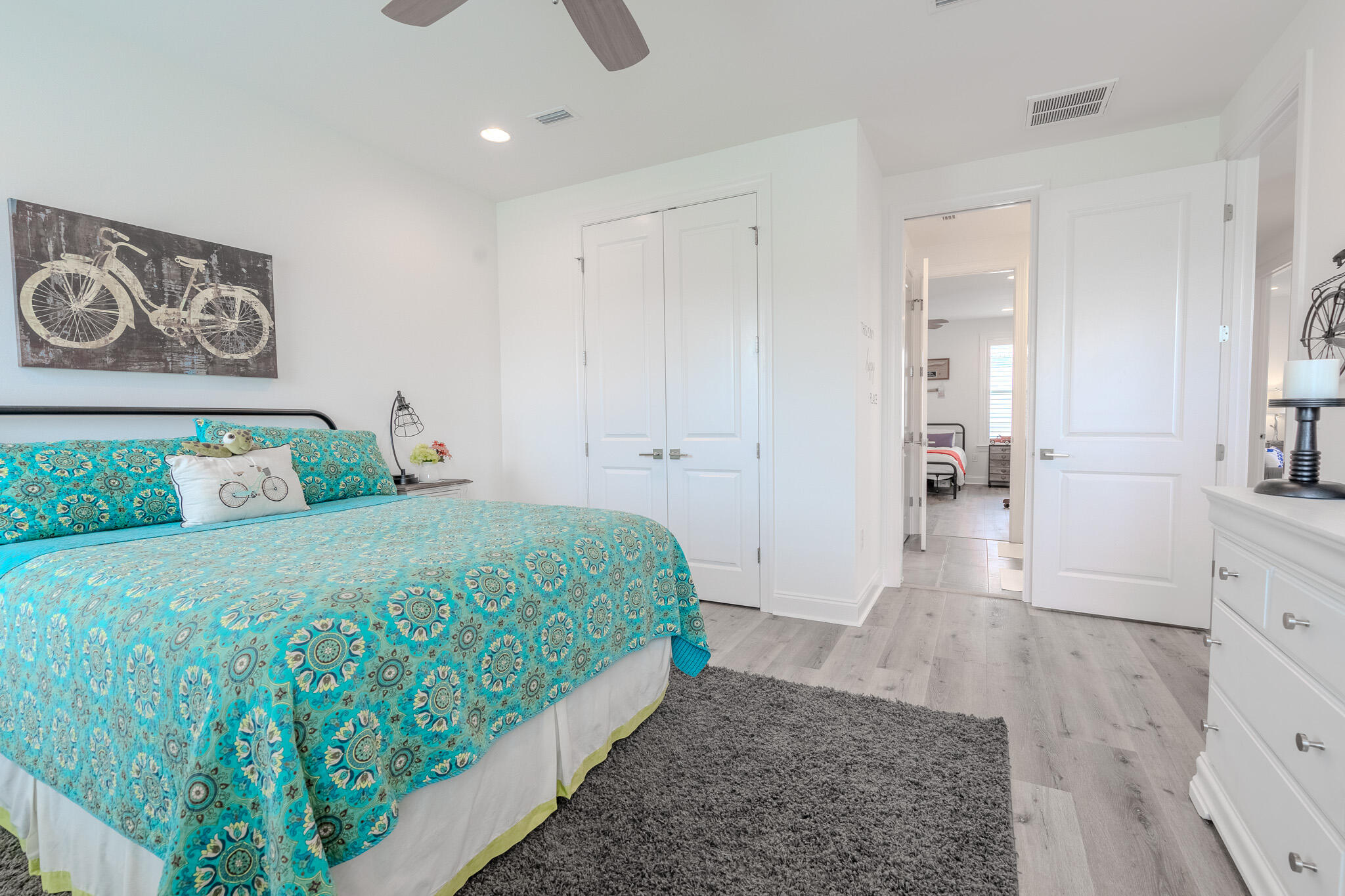 75 Conifer Ct Inlet Beach Inlet Beach, FL 32461 - Photo 40 of 74 a bedroom with a bed and painting on the wall