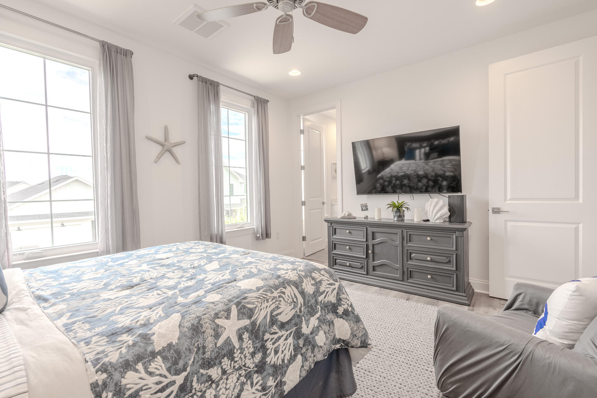 75 Conifer Ct Inlet Beach Inlet Beach, FL 32461 - Photo 46 of 74 a bedroom with a bed and a flat screen tv