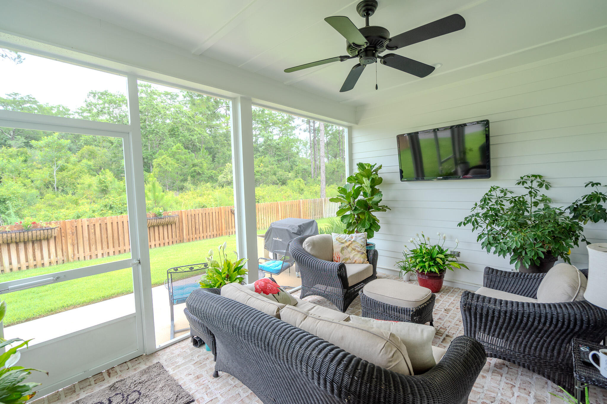 75 Conifer Ct Inlet Beach Inlet Beach, FL 32461 - Photo 50 of 74 a living room with furniture and a floor to ceiling window