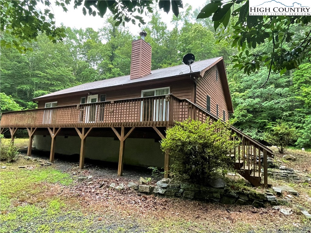 305 Signal Tree Road Deep Gap, NC 28618 - Photo 1 of 33 a view of a house with a backyard