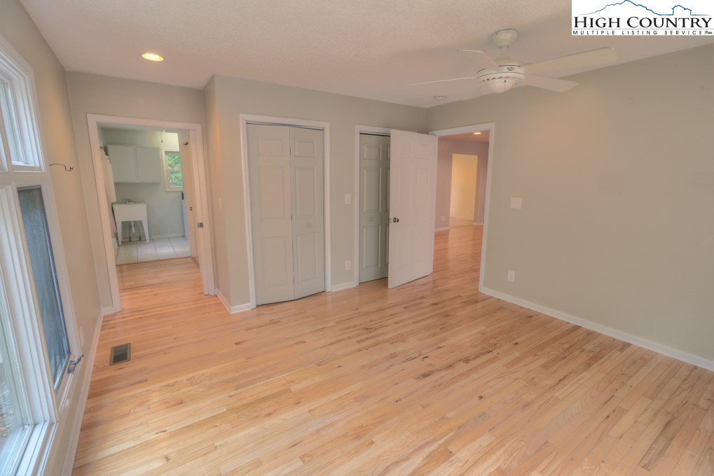305 Signal Tree Road Deep Gap, NC 28618 - Photo 13 of 33 a view of an empty room and wooden floor