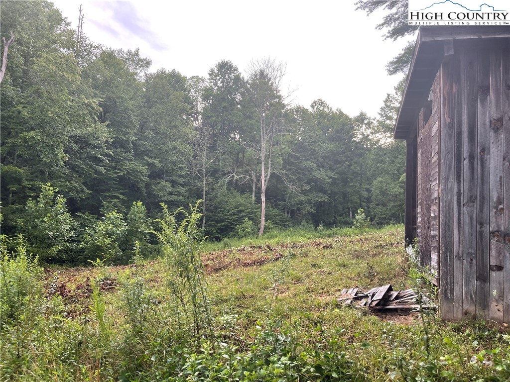 305 Signal Tree Road Deep Gap, NC 28618 - Photo 28 of 33 a backyard of a house with a yard and outdoor seating