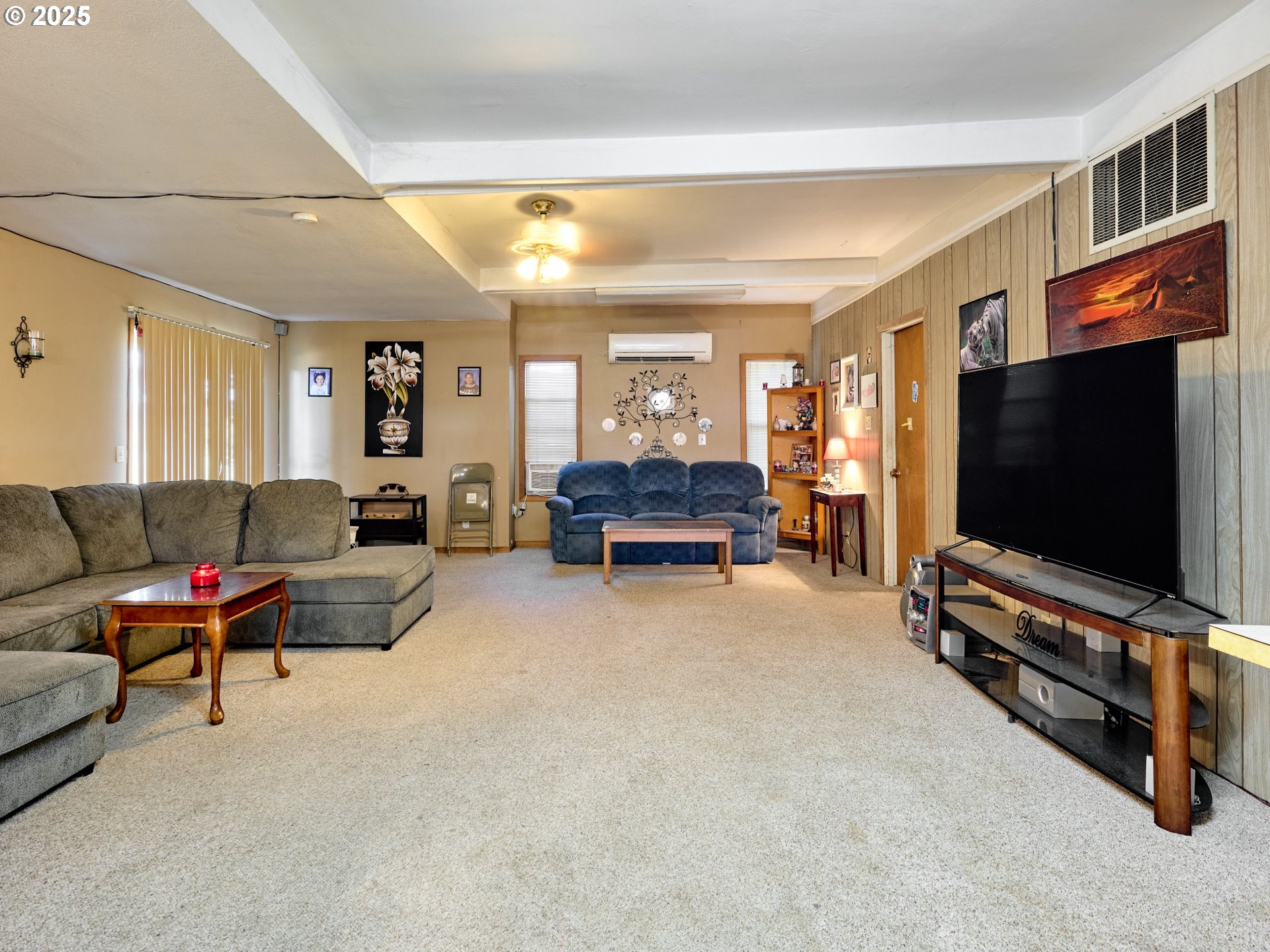 4481 Hennies Road Southeast Turner, OR 97392 - Photo 35 of 47 a living room with furniture and a flat screen tv