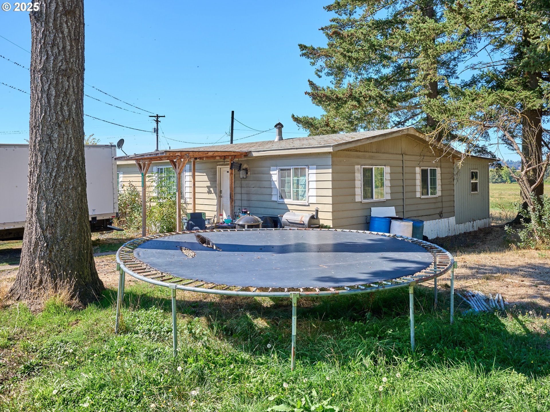 4481 Hennies Road Southeast Turner, OR 97392 - Photo 38 of 47 a view of house with backyard and outdoor seating