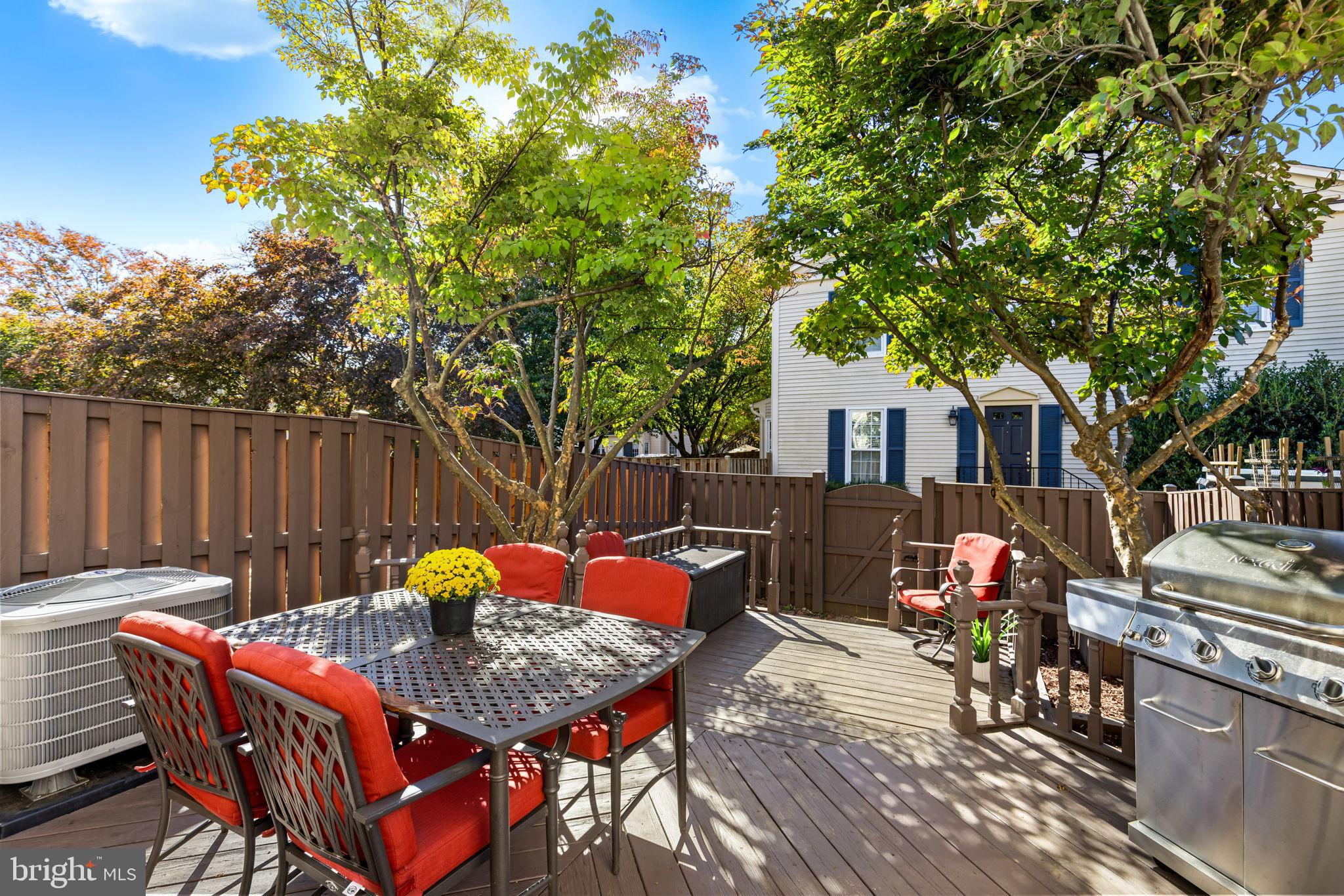 6223 Walkers Croft Way Alexandria, VA 22315 - Photo 17 of 38 a backyard of a house with table and chairs